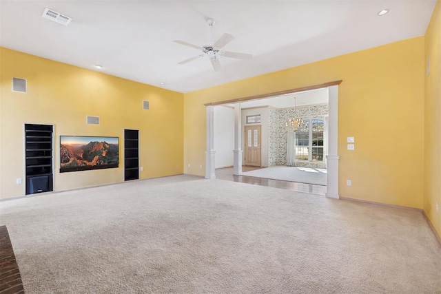 unfurnished living room featuring visible vents, baseboards, recessed lighting, carpet flooring, and ceiling fan with notable chandelier