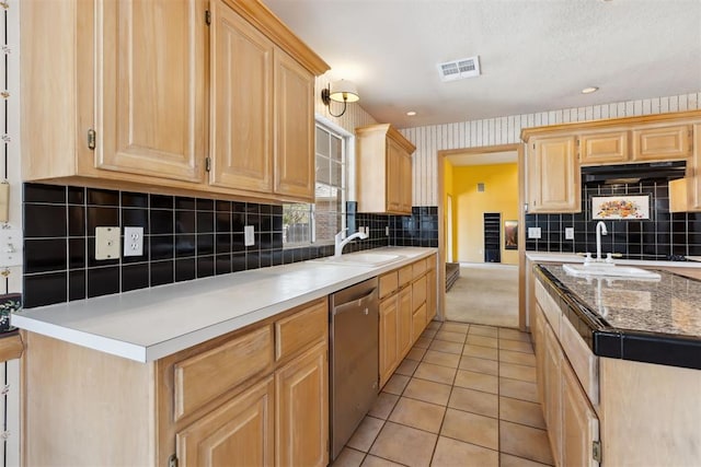 kitchen with dishwasher, wallpapered walls, and light brown cabinetry