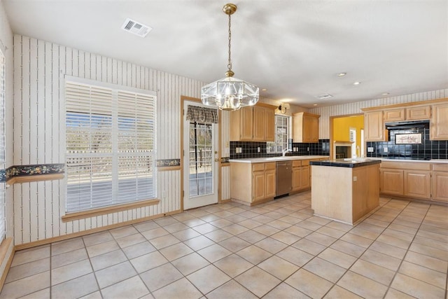 kitchen with visible vents, light brown cabinets, and wallpapered walls