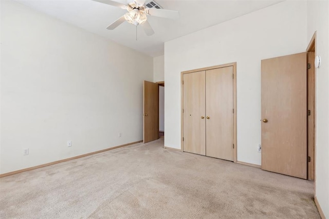 unfurnished bedroom with visible vents, ceiling fan, baseboards, light carpet, and a closet