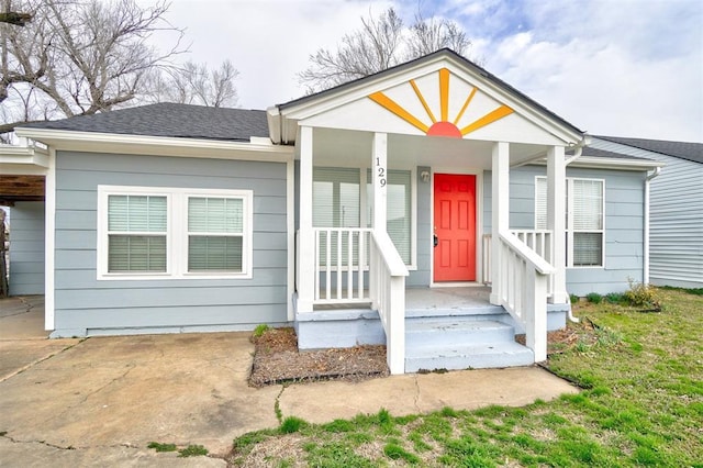 view of front of home featuring a porch and roof with shingles