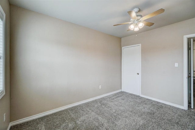 unfurnished bedroom with carpet, baseboards, and ceiling fan