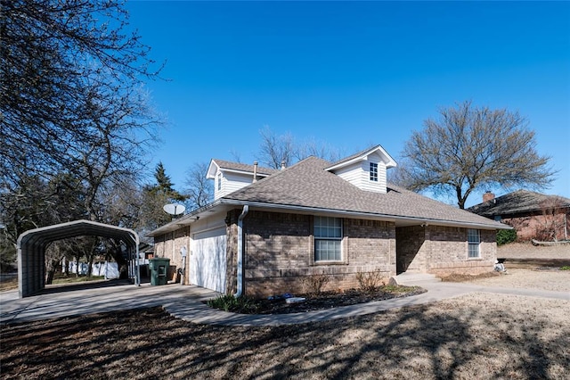 view of property exterior featuring brick siding, a detached carport, concrete driveway, and roof with shingles