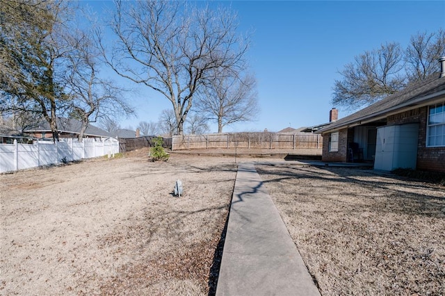 view of yard featuring a fenced backyard