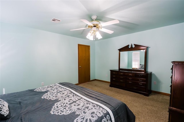 bedroom with visible vents, baseboards, carpet, and ceiling fan