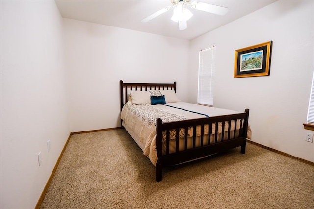 bedroom featuring baseboards, carpet, and a ceiling fan