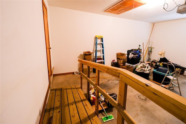 interior space featuring wood finished floors and baseboards