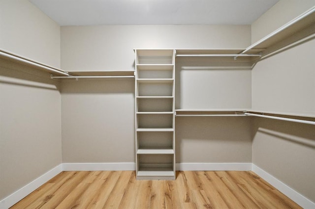 spacious closet with wood finished floors