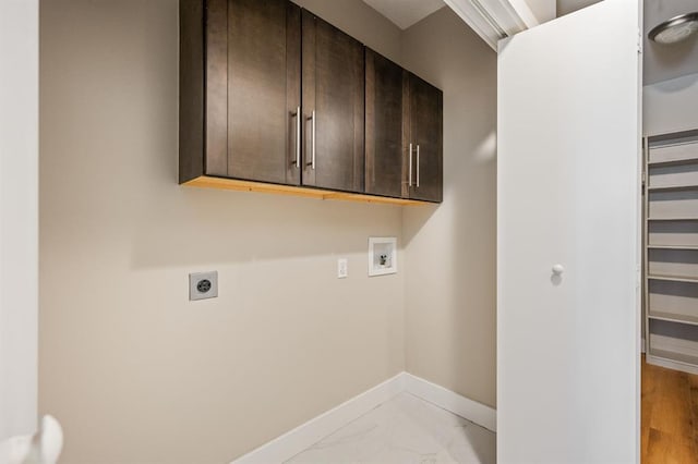 laundry area featuring electric dryer hookup, marble finish floor, cabinet space, baseboards, and hookup for a washing machine