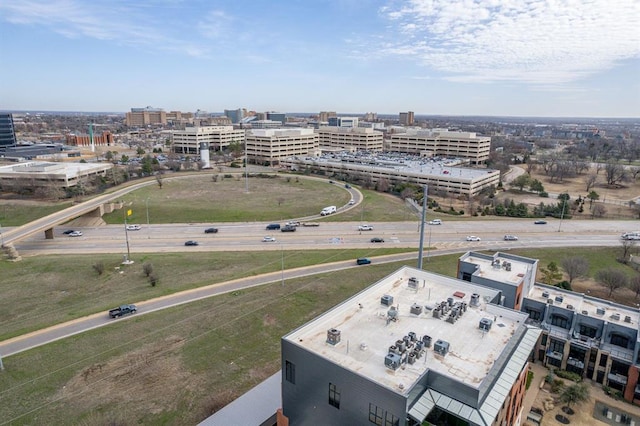 birds eye view of property featuring a city view
