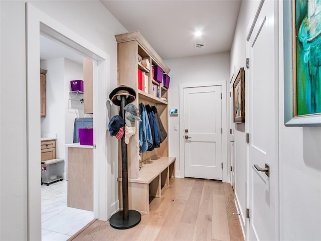 mudroom with visible vents and light wood-type flooring