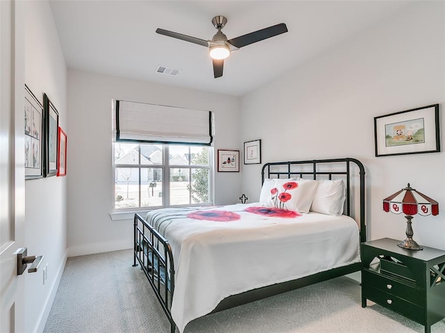 bedroom with visible vents, baseboards, a ceiling fan, and carpet flooring