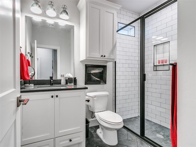 full bath featuring vanity, toilet, and a stall shower