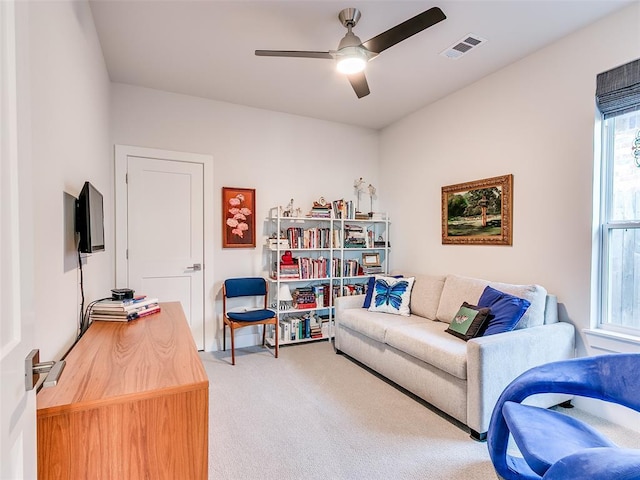 interior space with visible vents and a ceiling fan