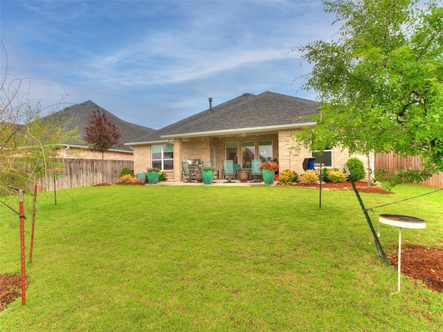 209 Pont Neuf Ct, Edmond, OK 73034 - back of property featuring brick siding, a patio area, and a shingled roof