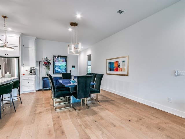 209 Pont Neuf Ct, Edmond, OK 73034 - dining room with light wood finished floors, baseboards, and recessed lighting