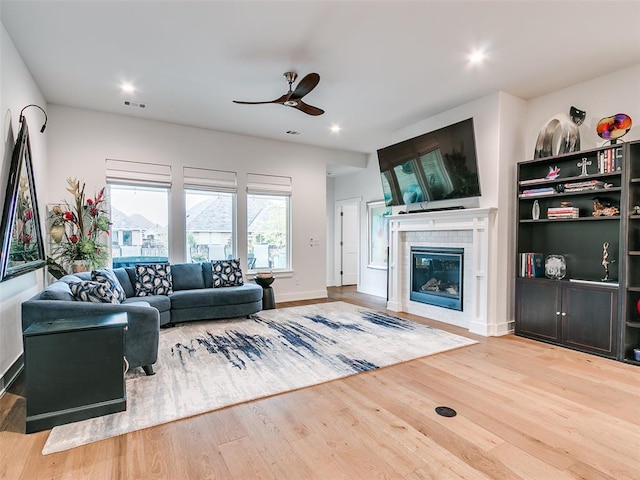 209 Pont Neuf Ct, Edmond, OK 73034 - living room with a ceiling fan, wood finished floors, a fireplace, recessed lighting, and baseboards