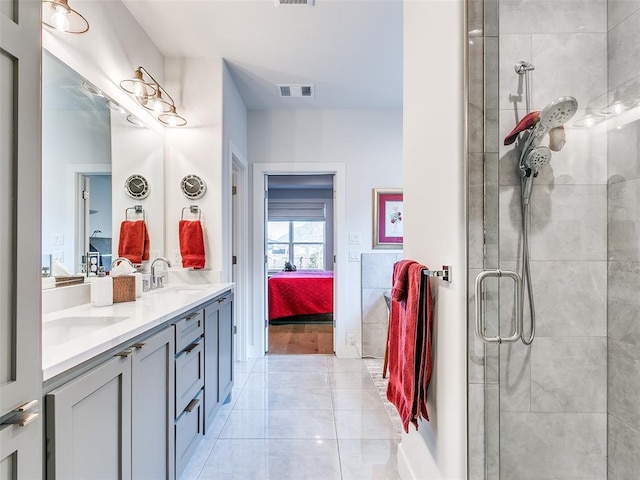 209 Pont Neuf Ct, Edmond, OK 73034 - full bathroom with ensuite bathroom, double vanity, and a tile shower