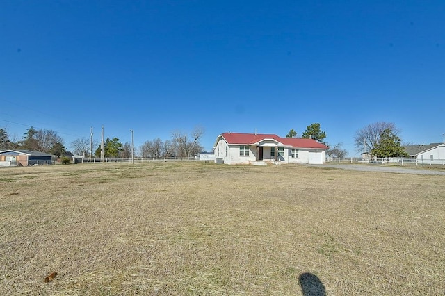 view of front of house with fence