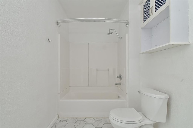 full bathroom with tile patterned floors, toilet, baseboards, and shower / bath combination