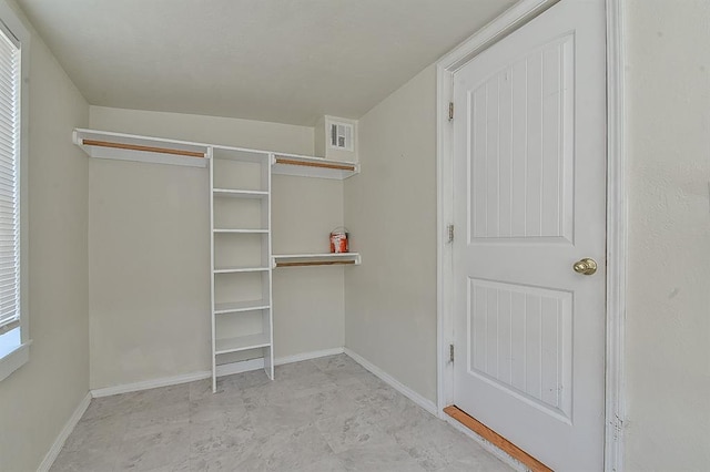 spacious closet featuring visible vents