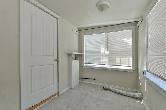 interior space featuring baseboards