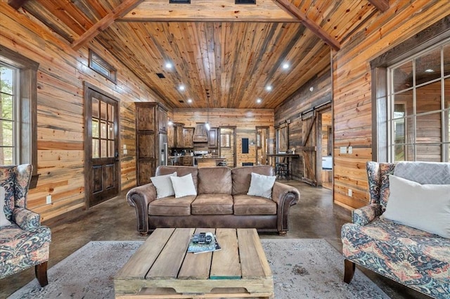 living room with a barn door, wood ceiling, and concrete flooring