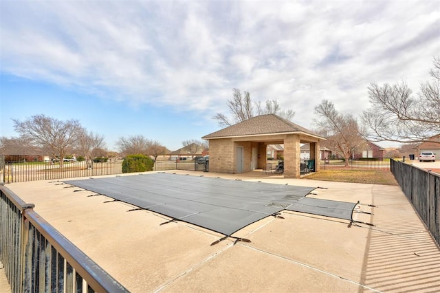 view of pool featuring a patio area, a fenced in pool, and fence