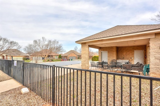 view of yard featuring outdoor dining area and fence