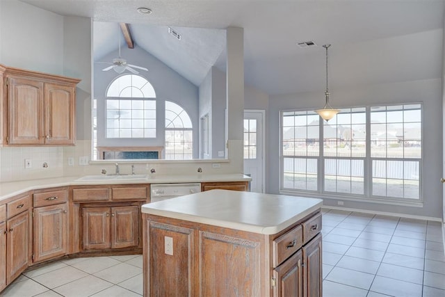 kitchen featuring visible vents, lofted ceiling with beams, light countertops, light tile patterned floors, and ceiling fan