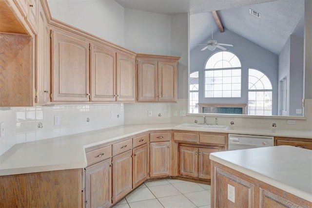 kitchen with ceiling fan, light brown cabinetry, a sink, dishwasher, and backsplash