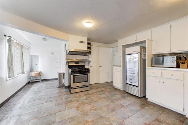 kitchen featuring white cabinets, exhaust hood, gas stove, and built in fridge