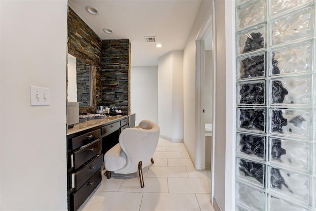 interior space featuring tile patterned floors, visible vents, recessed lighting, and baseboards