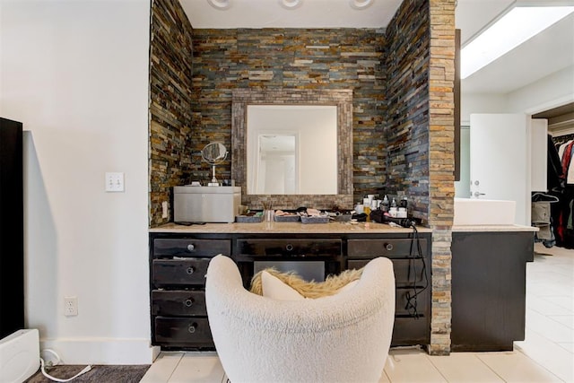 bathroom featuring tile patterned flooring and vanity