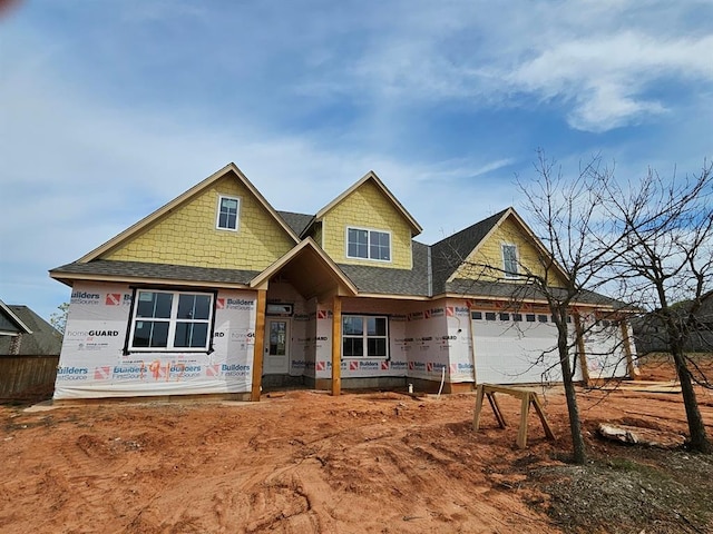 view of front facade featuring a shingled roof
