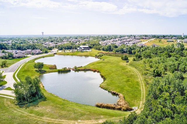 drone / aerial view with a residential view and a water view