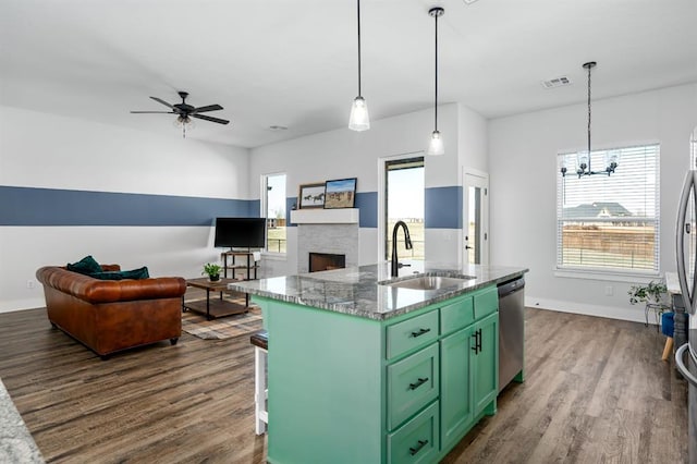 kitchen featuring visible vents, a sink, dishwasher, a wealth of natural light, and green cabinetry