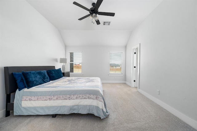 carpeted bedroom featuring visible vents, ceiling fan, baseboards, and lofted ceiling