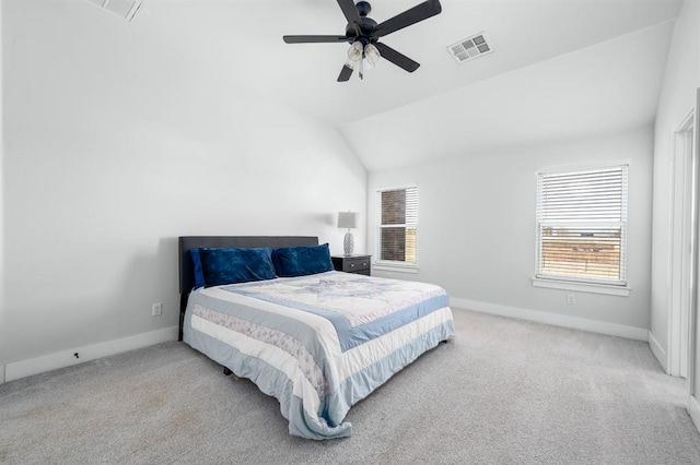 carpeted bedroom featuring a ceiling fan, vaulted ceiling, baseboards, and visible vents