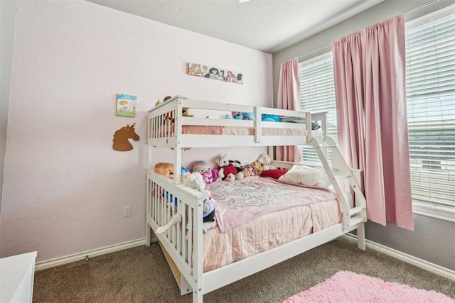 bedroom featuring baseboards and carpet floors