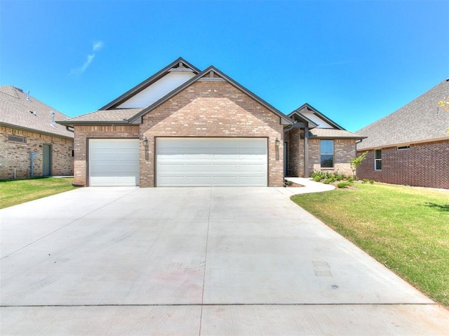 ranch-style house with brick siding, a shingled roof, a front lawn, concrete driveway, and an attached garage