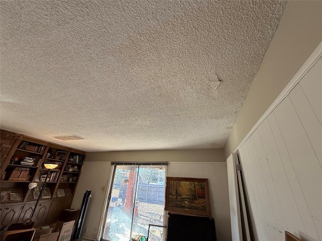 interior details with visible vents and a textured ceiling