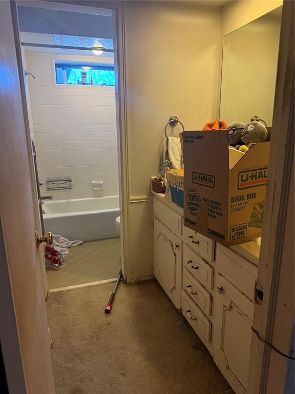 bathroom with vanity, toilet, and washtub / shower combination