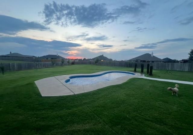 view of pool featuring a fenced backyard, a fenced in pool, and a yard