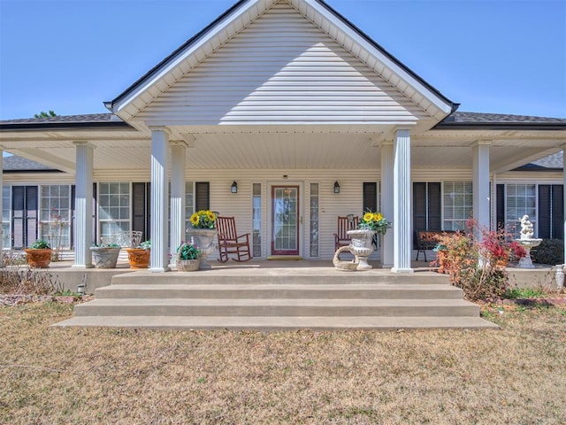 rear view of house with a porch