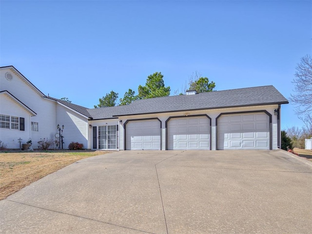 garage featuring driveway