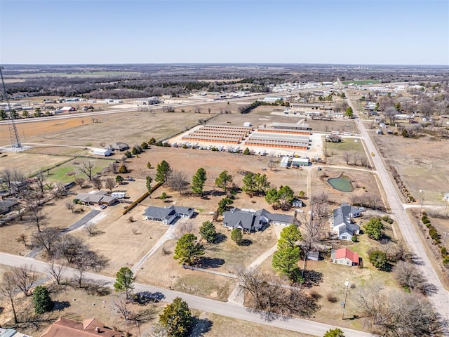 birds eye view of property with a rural view