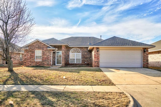 single story home featuring a front lawn, concrete driveway, a shingled roof, a garage, and brick siding