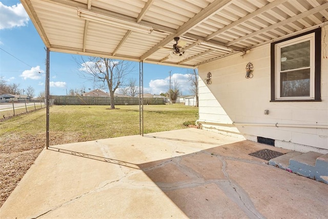 view of patio featuring fence