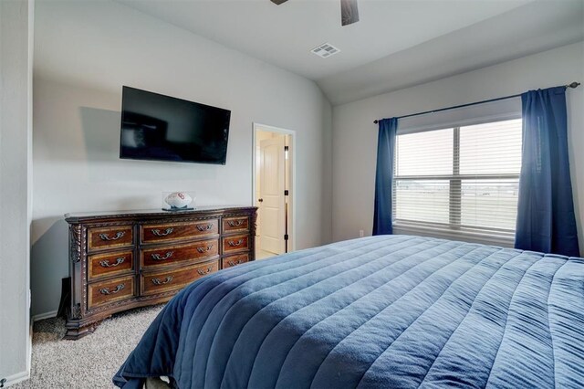 carpeted bedroom with visible vents, baseboards, a ceiling fan, and vaulted ceiling